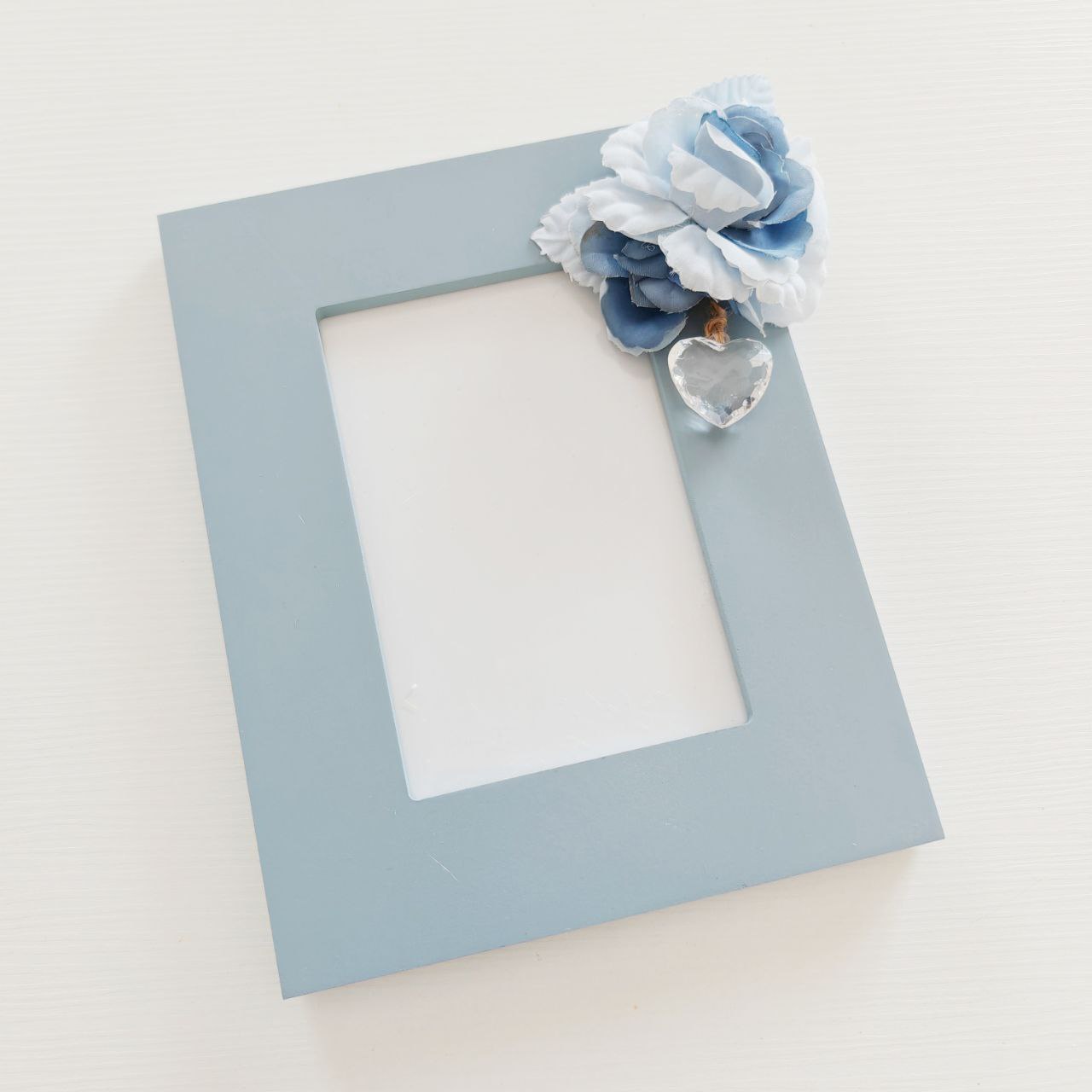 Cornice bluette con fiore - Best Moment Decor