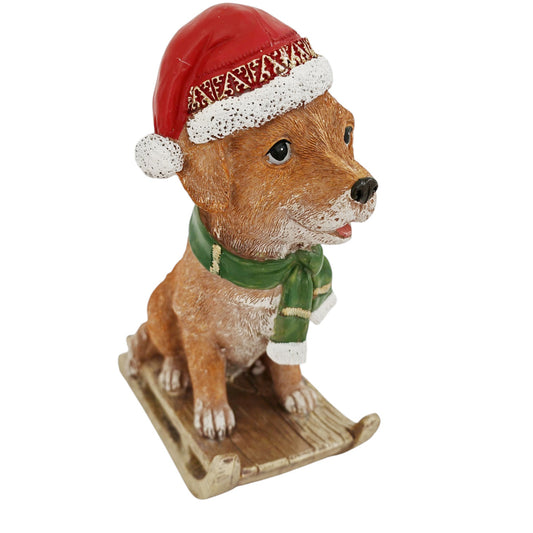 Cagnolino d'appoggio su slitta rosso