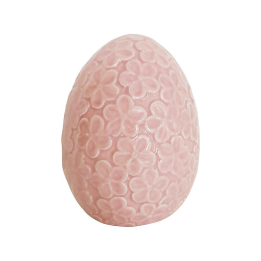 Uovo floreale rosa in porcellana