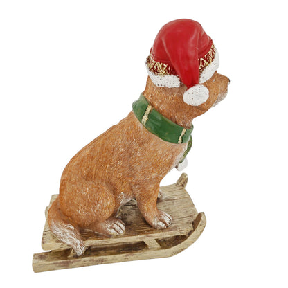 Cagnolino d'appoggio su slitta rosso